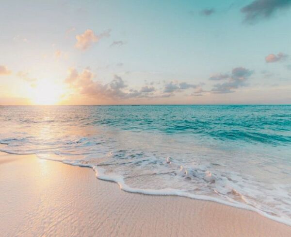 Boardwalk by calm sea with soft waves
